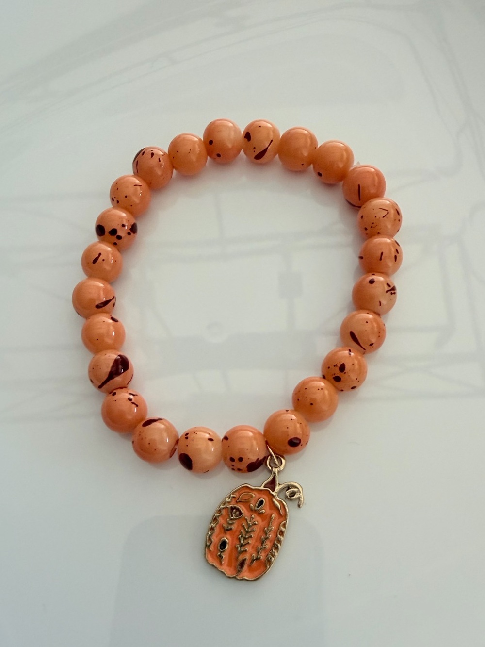 Orange Beaded Bracelet with Pumpkin Charm